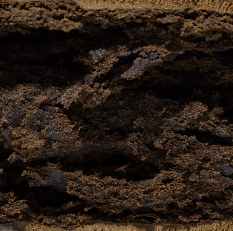 Dark rectangular Banana OG Kush Hash block with a gold banana symbol 2