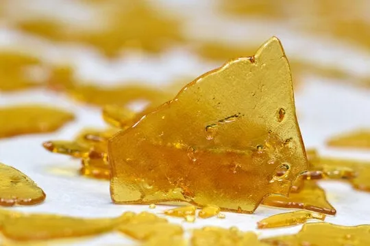 Amber shatter shards rising from an illustrated bowl of cereal and milk for Cereal Milk 3