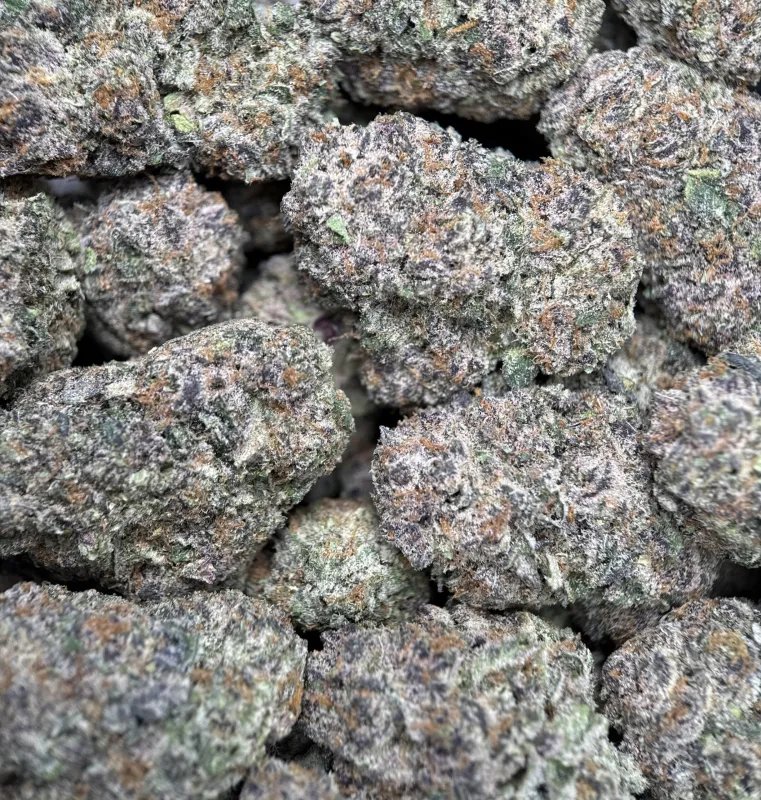 Dense green Dynamite Diesel buds with orange hairs and frost 4